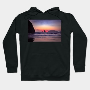 Red sunset behind coastal rock Hoodie